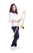 Teenage girl with trombone. Isolated on a white background. Studio shot