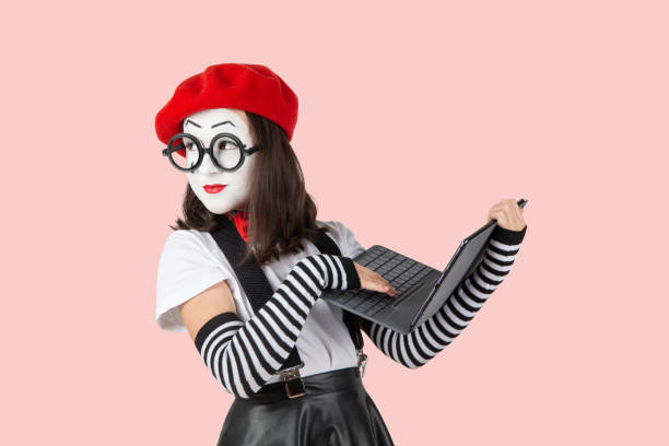 teenage girls in the image of mimes with makeup on their faces, isolate on a white background teenage girls in the image of mimes with makeup on their faces, isolate on a white background mime artist stock pictures, royalty-free photos & images