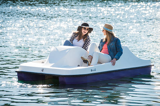 Teenage Girls on a Paddle Boat stock photo