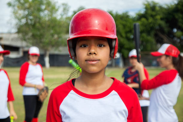 Teenage woman baseball player stock photo