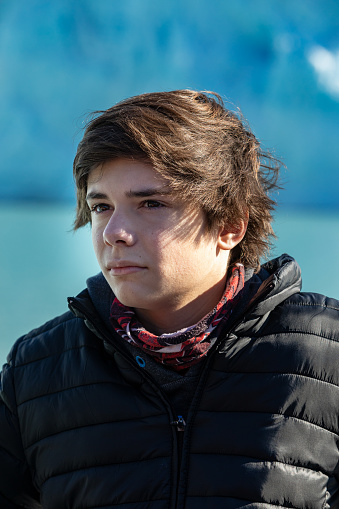 Handsome 14 years old boy at the Glaciar Pertito Moreno- Patagonia