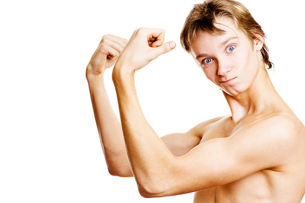 Teenager Boy Showing muscles  teenage boys men blond hair muscular build stock pictures, royalty-free photos & images