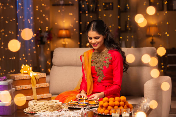 Teenager girl Diwali Celebrate - stock photo Indian, Indian Culture, Traditional, Festival, Diwali, Girls, mithai stock pictures, royalty-free photos & images