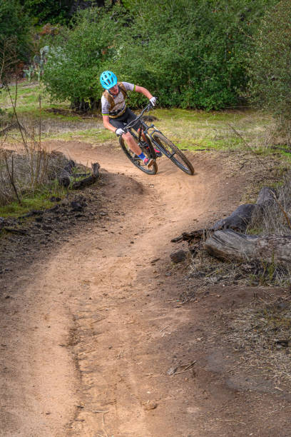 Teenager MTB In The Rocks Kid MTB, Lake Hodges, CaliforniaTeenager MTB, Lake Hodges, California in a technical rock section. lake hodges stock pictures, royalty-free photos & images