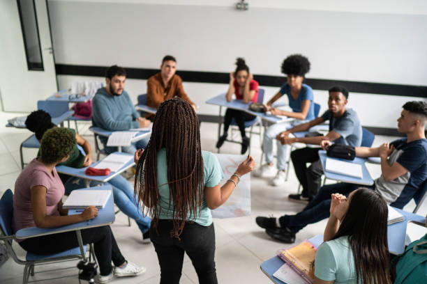 Teenager student doing a presentation in the classroom stock photo