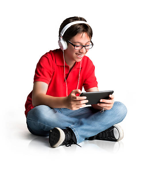 Teenager surfing the web using a tablet stock photo