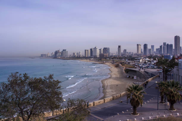 Tel Aviv beach and city Skyline  in the purple morning mist Israel stock photo