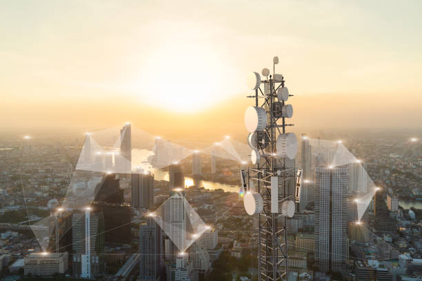 Telecommunication tower with 5G cellular network antenna on city background Telecommunication tower with 5G cellular network antenna on city background 5g stock pictures, royalty-free photos & images