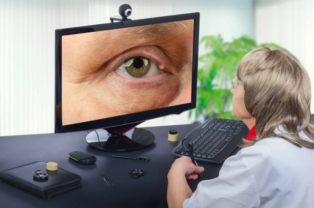Telemedicine eye doctor observes eyelid cyst on computer stock photo
