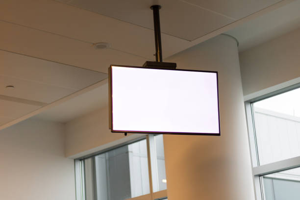 Television set in the ceiling in public area for advertisement. stock photo