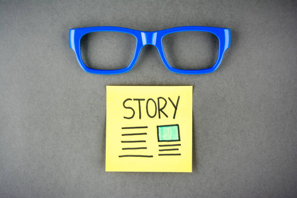 Telling a story concept on dark background. Storytelling concept and eyeglasses. Telling a story concept on dark background. Storytelling concept and eyeglasses. visual content stock pictures, royalty-free photos & images