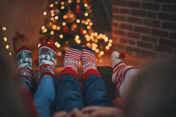 Telling Stories in Cosy Christmas Atmosphere Little Kids Sitting in Living Room and Telling Stories in a Cosy Christmas Atmosphere christmas story telling stock pictures, royalty-free photos & images