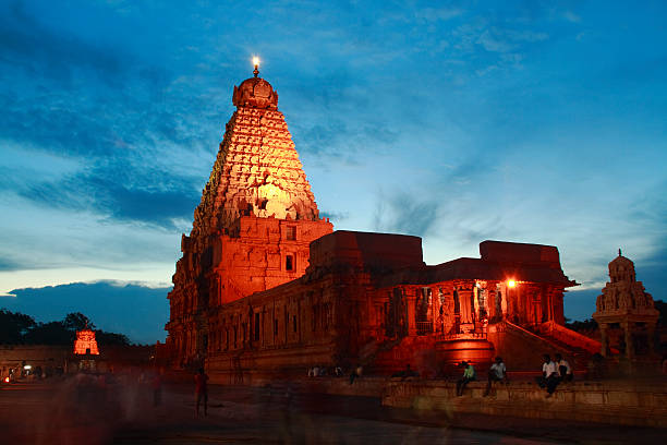 Temple night view Thanjavur, India - August 31, 2008: A night view of the Sri Brahadeeswarar Temple in Thanjavur (Tamil Nadu). The temple is one of the best mantained and restored in India, part of a UNESCO World Heritage Site, and draws daily crowds of visitors and pilgrims. pilgrims monument stock pictures, royalty-free photos & images
