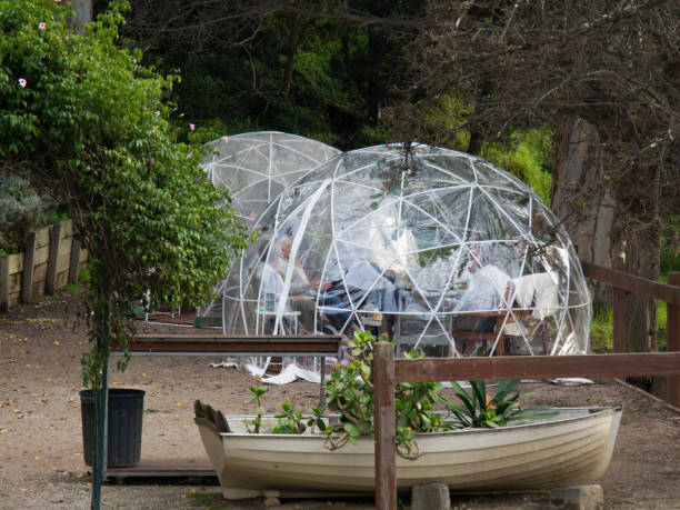 Temporary covid-safe outdoor dining igloo bubbles stock photo