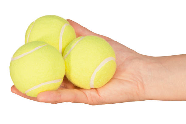 tennis-balls-in-hand-picture-id152044888?k=20&m=152044888&s=612x612&w=0&h=mSN87i3O4vo3JbRr6MkG-QNdZqBJmZ1w4mVPfH4Pnxo=