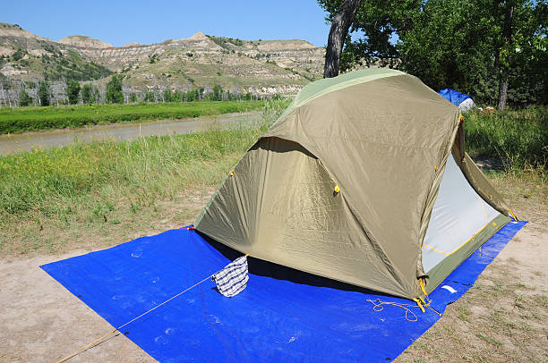 Tent near Little Missouri River, Theodore Roosevelt NP, North Dakota Camping near the Little Missouri River in the South unit of  Theodore Roosevelt National Park, North Dakota theodore roosevelt national park stock pictures, royalty-free photos & images