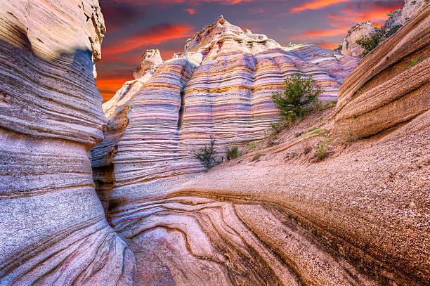 Tent Rocks Canyon at Sunrise Dramatic sunrise as seen from a canyon near Cochiti, NM rock formation stock pictures, royalty-free photos & images