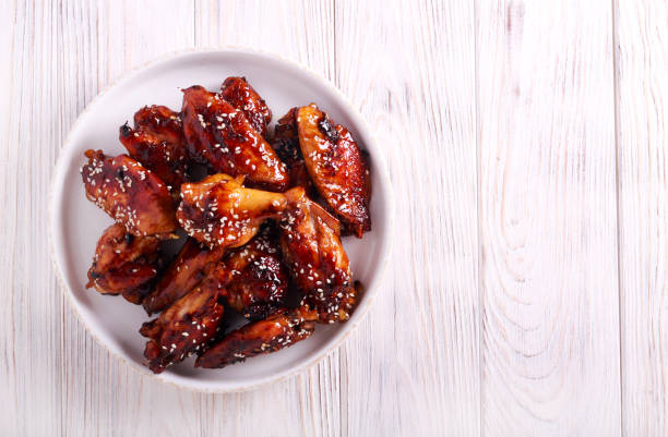 Teriyaki chicken wings with sesame Teriyaki chicken wings with sesame on plate animal limb stock pictures, royalty-free photos & images