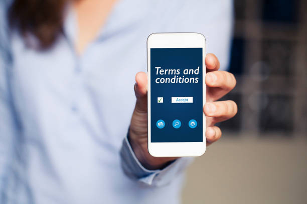 Terms and conditions contract in a mobile phone screen. stock photo