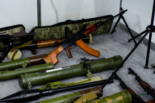 Terrorist weapon cache, grenade launchers, assault rifles and machine guns stock photo