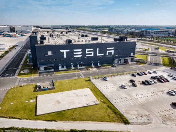 Tesla car factory, Shanghai Shanghai, China - August 1, 2020: Exterior view of automobile plant Tesla Gigafactory 3 located in Pudong District, Shanghai, China. tesla motors stock pictures, royalty-free photos & images