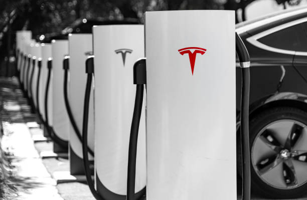 Tesla Charging on the Tesla Supercharging fast charging network stock photo
