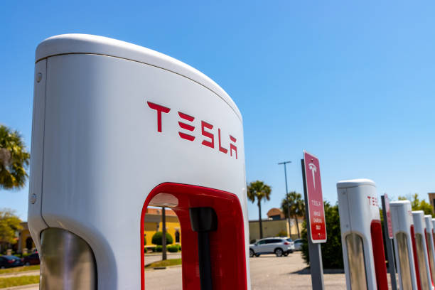 Tesla electric car charger Myrtle Beach, South Carolina - April 13, 2021: A Tesla electric car supercharger in a commercial parking lot. tesla motors stock pictures, royalty-free photos & images