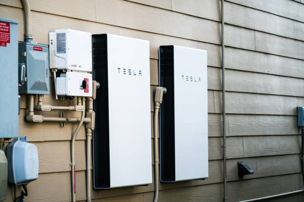 Tesla Powerwall Home Battery storage solution to help go fully self sustinable for Climate Change Austin , Texas , USA - January 26th 2020: Tesla Powerwall Home battery storage connecting home energy storage with solar panels and powering the grid with a self sustaining future batteries stock pictures, royalty-free photos & images