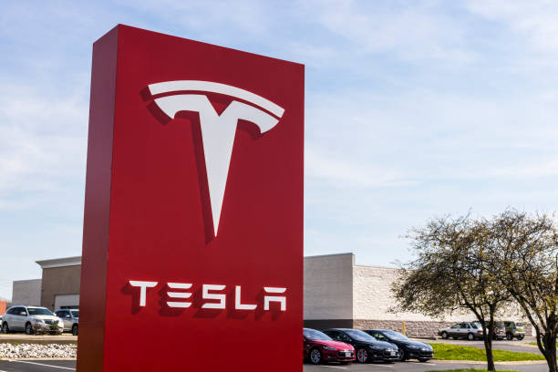 Tesla Service Center. Tesla designs and manufactures the Model S electric sedan IV stock photo