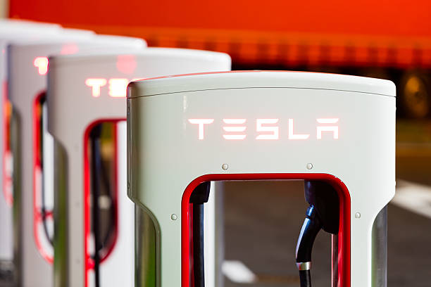 Tesla Supercharger station Brenner, Italy - May 8, 2016: Tesla charging stations are located throughout EU to accommodate owners of the electric car. tesla motors stock pictures, royalty-free photos & images