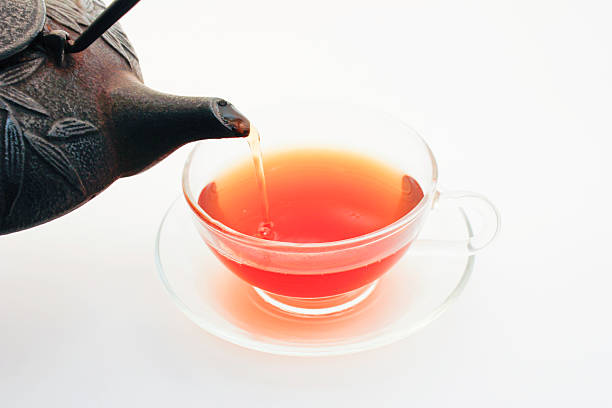 Tetsubin Pouring Tea Into Teacup stock photo
