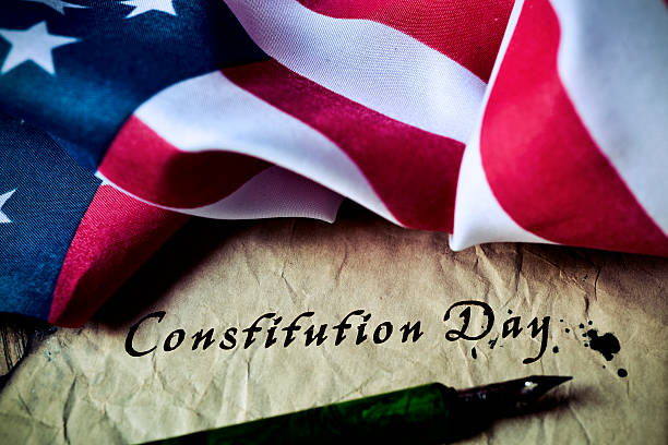 text constitution day and flag of USA stock photo