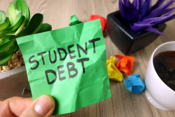 Text student debt handwritten on sticky note Text student debt handwritten on sticky note, financial concept student debt stock pictures, royalty-free photos & images