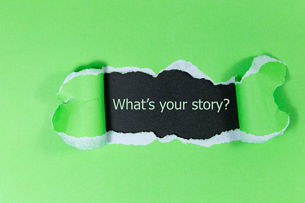Text 'What's your story?' appears under the torn paper. stock photo