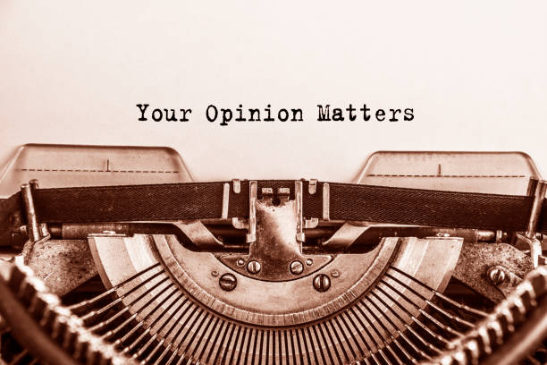 Text Your Opinion Matters typed on vintage typewriter retro stock photo