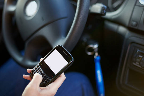 texting and driving car stock photo