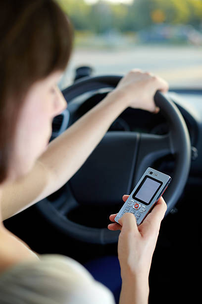 texting and driving car stock photo