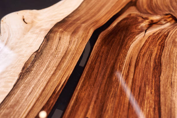 Texture of a wooden table with epoxy resin. stock photo