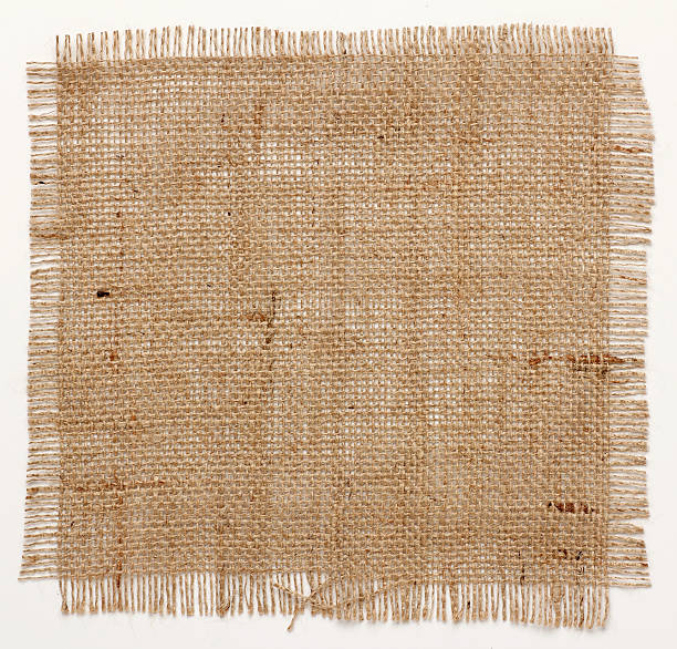texture of Burlap hessian square with frayed edges stock photo