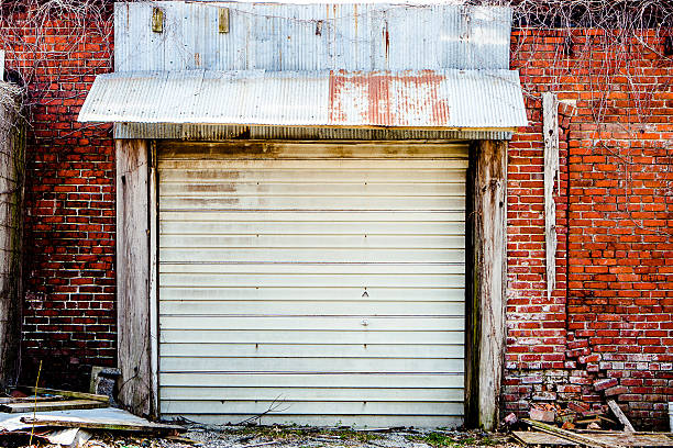 Texture - Old Garage Door, Brick Wall, Vines stock photo