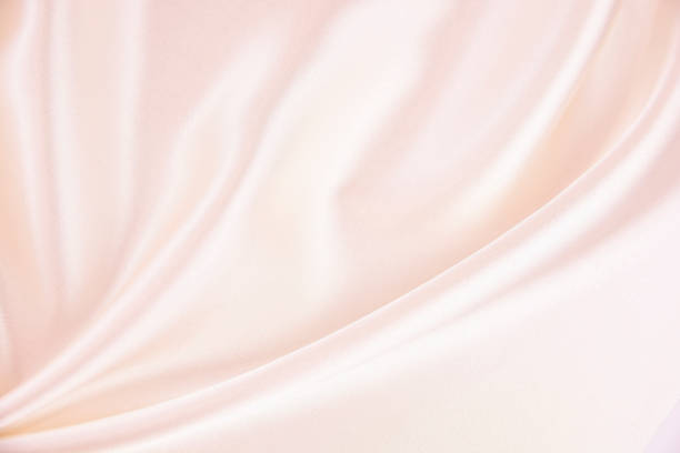 背景のためのテクスチャサテン生地ピンクの色 - 布 ストックフォトと画像