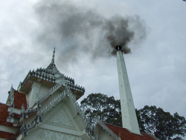 thai crematory with smoke on sad day thai crematory with smoke on sad day crematorium stock pictures, royalty-free photos & images