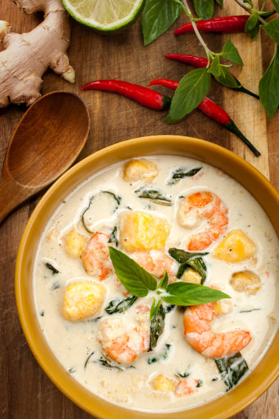 Thai green curry with shrimps and mango stock photo