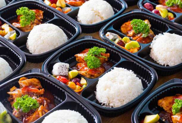 Thai lunch boxes in plastic packages. Ready to eat asian rice box, Thai food in take away plastic boxes. curry meal stock pictures, royalty-free photos & images