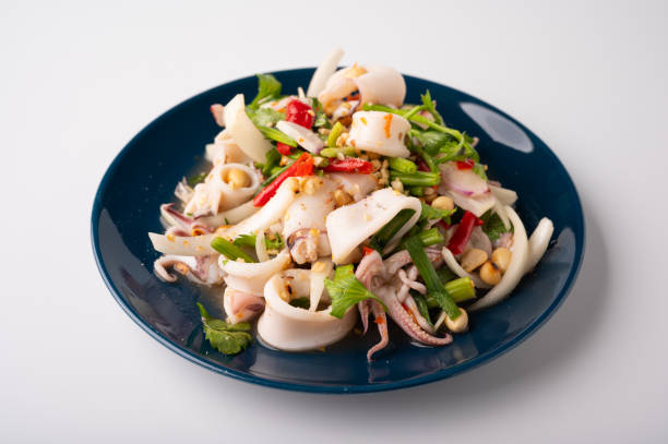 Thai Spicy Squid Salad in plate stock photo