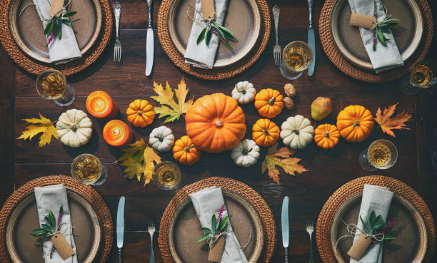 Thanksgiving celebration traditional dinner table setting Thanksgiving celebration traditional dinner. Festive table setting banquet stock pictures, royalty-free photos & images