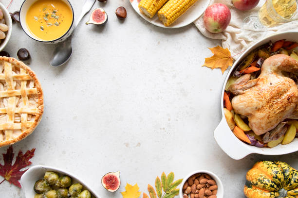 Thanksgiving dinner with chicken, apple pie, pumpkin soup brussel sprouts and fruits. Thanksgiving dinner with chicken, apple pie, pumpkin soup brussel sprouts and fruits. Traditional autumn food concept. Flat lay. thanksgiving food stock pictures, royalty-free photos & images