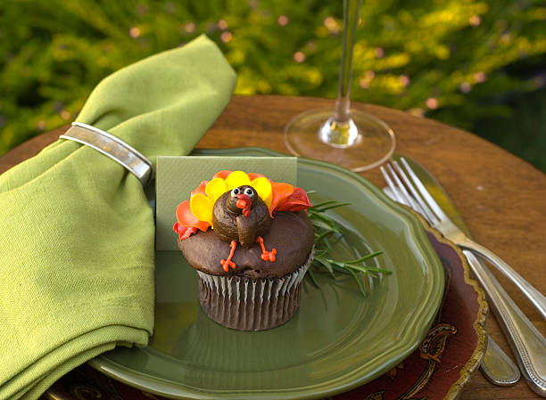 Thanksgiving Turkey Cupcake & Table Place Setting "Thanksgiving dinner place setting with turkey cupcake. (SEE LIGHTBOXES BELOW for more cake, dining table & holiday food & sweet dessert food...)" cute turkey cupcakes stock pictures, royalty-free photos & images