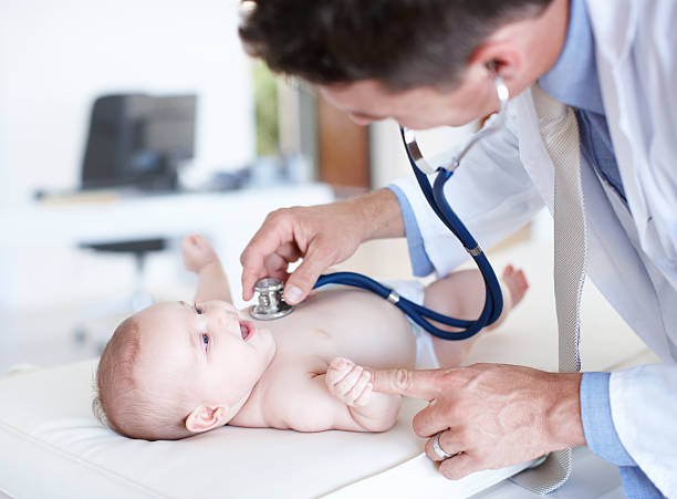 That tickles  pediatrician stock pictures, royalty-free photos & images