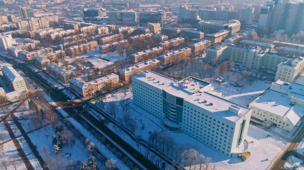 The aerial panoramic view on the winter city covered by the snow in the bright cold sunny day. Orbit camera motion. The aerial panoramic view on the residential district of the winter city covered by the snow in the bright cold sunny day.  Minsk, Belarus, Eastern Europe minsk stock pictures, royalty-free photos & images